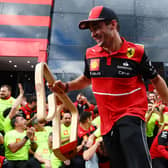 Charles Leclerc celebrates with Ferrari after winning in Austria