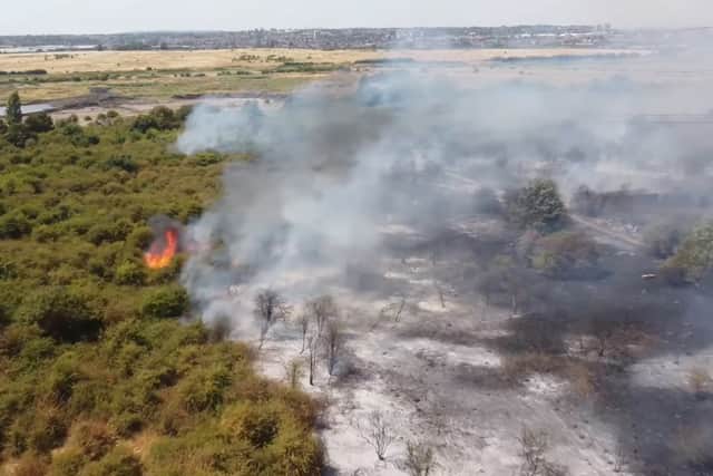 Handout grab from video issued by Luke Channings of the scene after a fire at Dartford Marshes. 