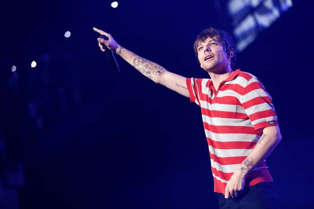 Louis Tomlinson performing in Colombia during his 2022 World Tour. (Photo by JUAN PABLO PINO/AFP via Getty Images)