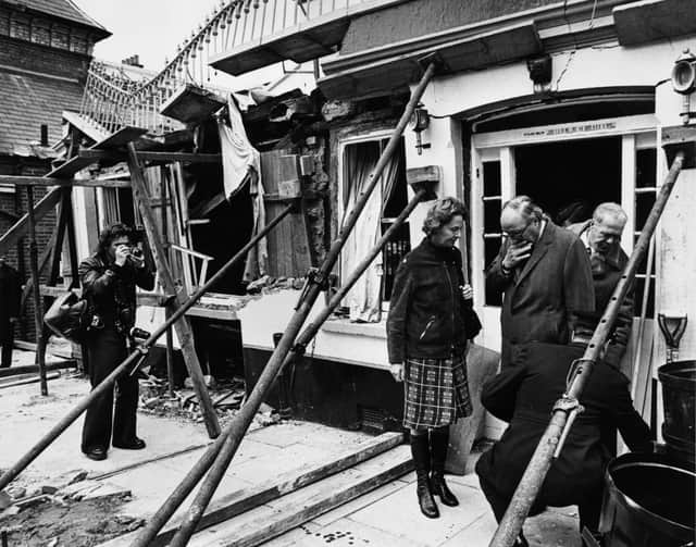 Former Home Secretary Roy Jenkins toured the rubble of the pub two days after the attack. (Credit: Getty Images)