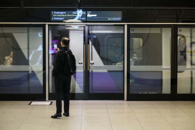 A man waits to board a train as the Elizabeth Line opens to the public at Paddington Station (Pic: Getty Images)