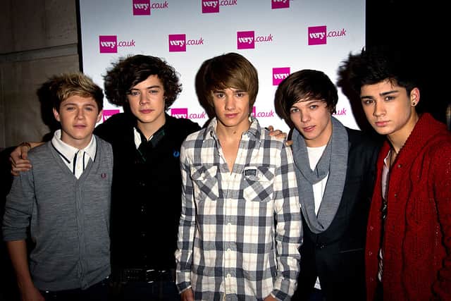 (L-R) Niall Horan, Harry Styles, Liam Payne, Zain Malik and Louis Tomlinson of ‘One Direction’ attends the Very.co.uk Christmas Catwalk Show at Victoria House on November 24, 2010 in London, England.  (Photo by Ian Gavan/Getty Images)