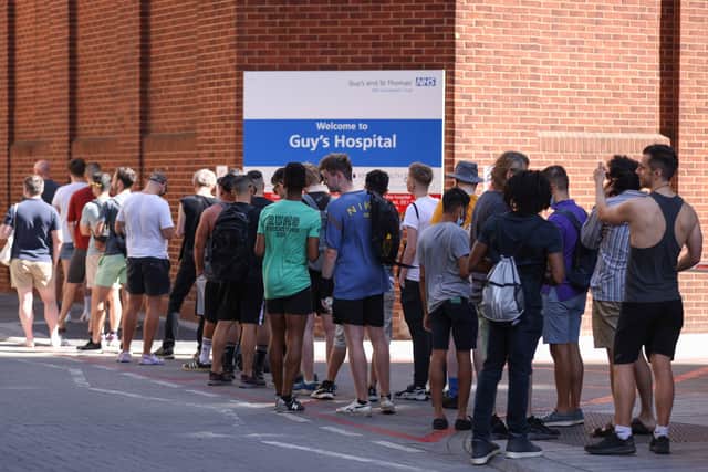 People line up to recieve monkeypox vaccinations at Guys Hospital in London (Image: Getty Images)