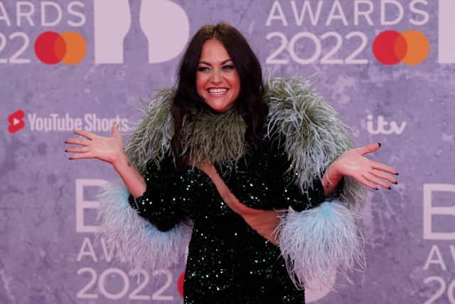 British actress Jaime Winstone poses on the red carpet upon her arrival for the BRIT Awards 2022 in London on February 8, 2022 (Photo by NIKLAS HALLE’N/AFP via Getty Images)
