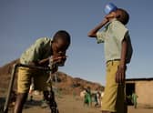 Pupils of El-molo bay primary school drink from a tap, in Loiyangalani, northern Kenya, on July 13, 2022. At least 18 million people across the Horn of Africa are facing severe hunger as the worst drought in 40 years devastates the region (Getty Images)