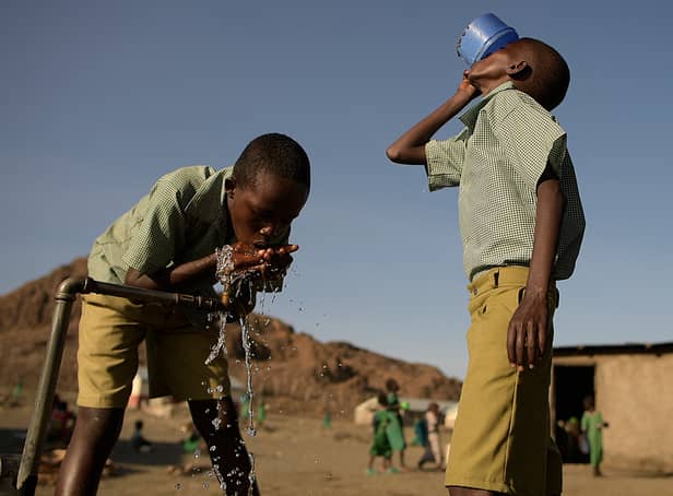 <p>Pupils of El-molo bay primary school drink from a tap, in Loiyangalani, northern Kenya, on July 13, 2022. At least 18 million people across the Horn of Africa are facing severe hunger as the worst drought in 40 years devastates the region (Getty Images)</p>