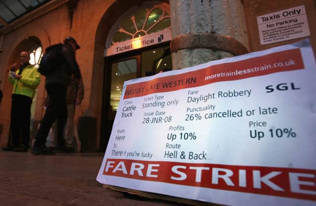 A placard greets commuter protesters from Bristol-based passenger group, ‘More Train Less Strain’