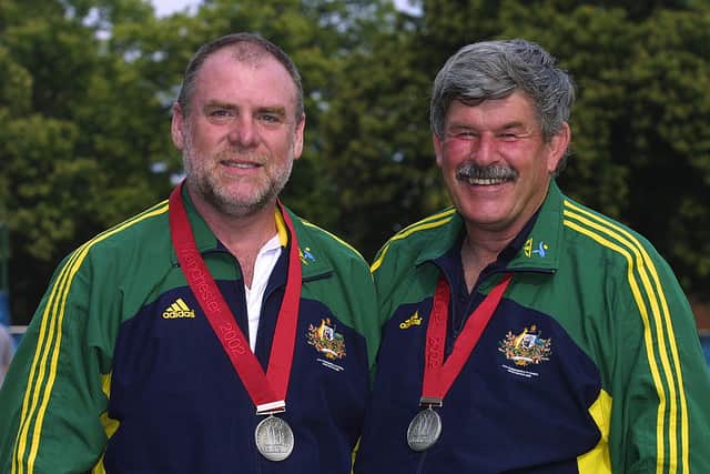 Bruce Quick [L] and Phillip Adams [R] of Australia celebrate winning silver in the Men’s 25m Standard Pistol Pairs Competition in Bisley, Surrey during the 2002 Commonwealth Games in Manchester, England on July 29, 2002. (Photo by Craig Prentis/Getty Images)