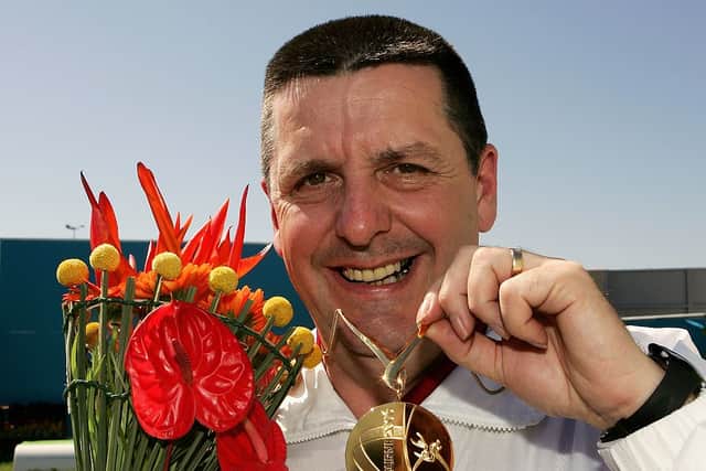 Mick Gault of England proudly displays his medal after winning Gold during the Men’s 25m Standard Pistol competition at the Melbourne International Shooting Club during day ten of the Melbourne 2006 Commonwealth Games on March 25, 2006 in Melbourne, Australia.    (Photo by Ross Land/Getty Images)