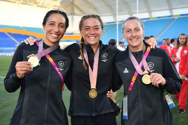 (L-R) Sarah Goss, Niall Williams and Kelly Brazier of New Zealand pose with their gold medals after the Women’s Gold Medal Rugby Sevens Match between Australia and New Zealand on day 11 of the Gold Coast 2018 Commonwealth Games at Robina Stadium on April 15, 2018 on the Gold Coast, Australia.  (Photo by Dan Mullan/Getty Images)