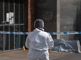 A forensic officer near the scene in Boston after a nine-year-old girl died from a suspected stab wound. Picture date: Friday July 29, 2022.