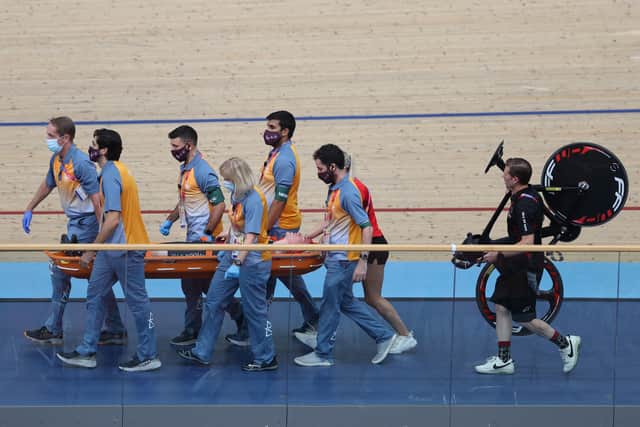 Isle of Man's Matthew Bostock is carried on a stretcher following a massive crash during the men's 15km scratch race qualifying round cycling event on day three of the Commonwealth Games, at the Lee Valley VeloPark in east London, on July 31, 2022. (Photo by ADRIAN DENNIS / AFP) (Photo by ADRIAN DENNIS/AFP via Getty Images)