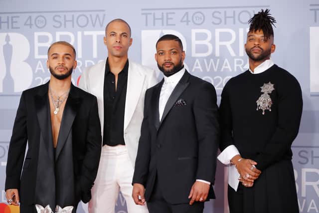 British group JLS, Aston Merrygold, Marvin Humes, JB Gill and Oritse Williams pose on the red carpet at the BRIT Awards 2020 in London