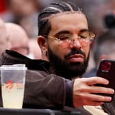 Drake texting (Getty Images)