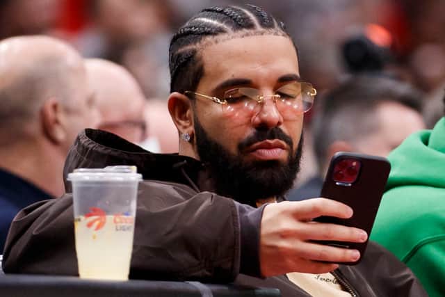 Drake texting (Getty Images)