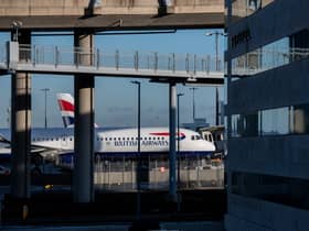 Planes of British Airways behind a hotel at Heathrow Airport. Photo: Chris J Ratcliffe/Getty Images