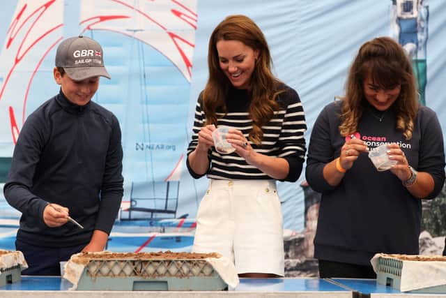 The Duchess of Cambridge meets a group of children taking part in the Protect Our Future programme by the 1851 Trust, the official charity of the Great Britain SailGP Team, during a visit in Plymouth, on July 31, 2022. (Photo by Jeff Gilbert / POOL / AFP) (Photo by JEFF GILBERT/POOL/AFP via Getty Images)