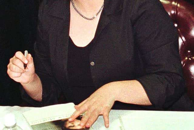 Monica Lewinsky looks up as she signs her book, ‘Monica’s story’, during a signing 23 April, 1999 at a book store in Fort Lauderdale, Florida.     (Photo by RHONA WISE/AFP via Getty Images)