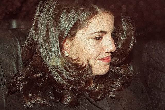 Monica Lewinsky sits in the back of a car on 29 January as she departs the Cosmos Club in Washington DC (Photo: LUKE FRAZZA/AFP via Getty Images)