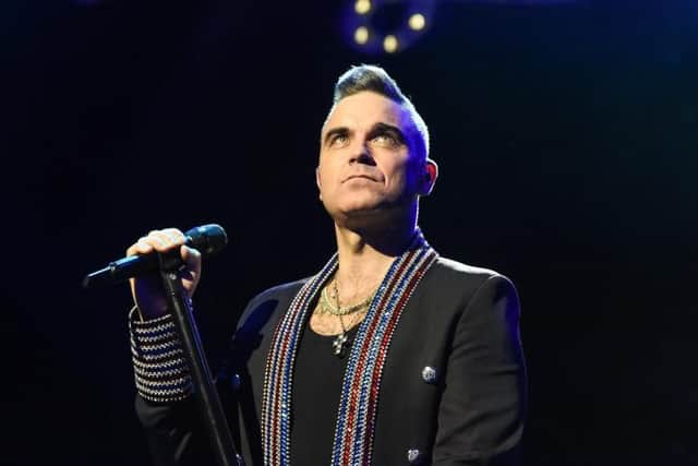 Robbie Williams performing live in 2019 