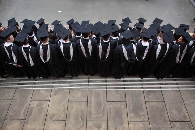 Students at the University of Birmingham pose for a group photograph after graduation (Pic: Getty Images)