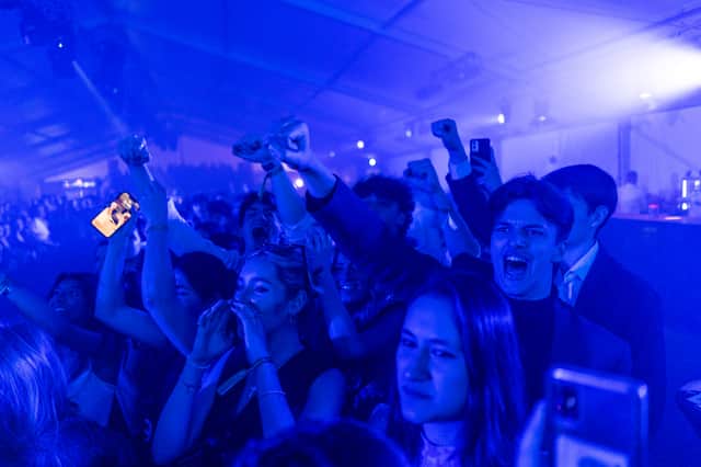 Students from St Andrews University are seen celebrating during a fashion show (Pic: Getty Images)