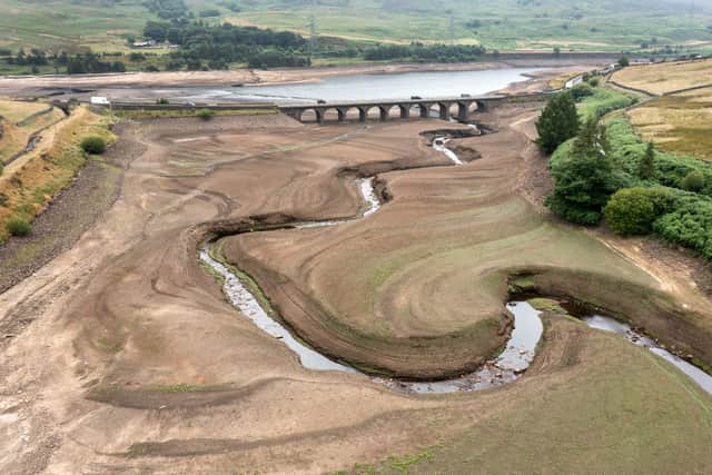 In this aerial view the bed of the Woodhead reservoir can be seen as Summer water levels become reduced on July 21, 2022 in Glossop, England. Recent high demand for drinking water, record temperatures and reduced rainfall has seen some reservoirs in England at only 62% capacity. (Photo by Christopher Furlong/Getty Images)