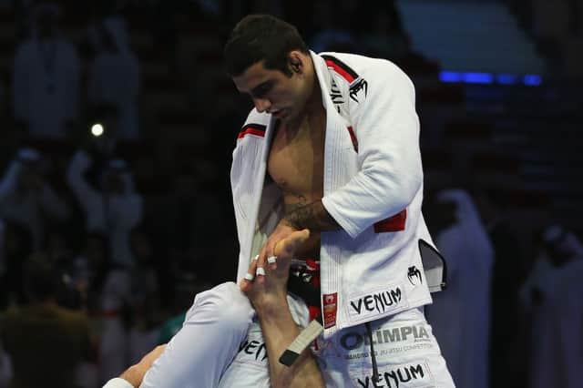 (L-R) Victor Estima of Brazil competes with Leandro Lo in the Men’s black belt 82kg finals during the Abu Dhabi World Professional Jiu-Jitsu Championship in April 2014 (Photo: Francois Nel/Getty Images)