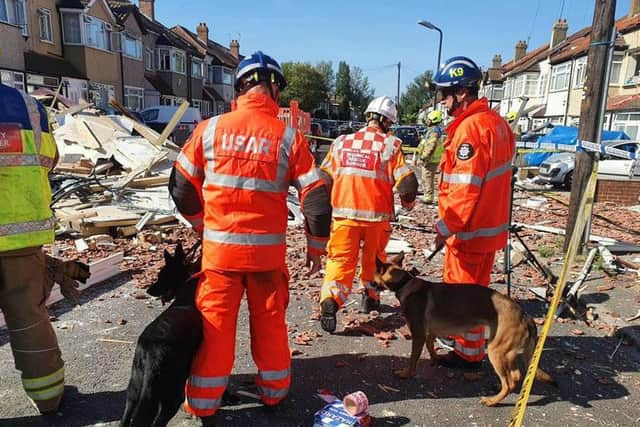 Handout photo issued by the London Fire Brigade of members of their Urban Search and Rescue team at the scene in Galpin’s Road (Photo: PA/London Fire Brigade)