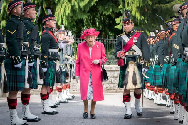 Queen Elizabeth II during an inspection of the Balaklava Company, 5 Battalion The Royal Regiment of Scotland at the gates at Balmoral, as she takes up summer residence at the castle, on August 9, 2021 in Ballater, Aberdeenshire. (Photo by Jane Barlow - WPA Pool/Getty Images)
