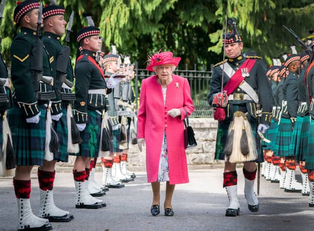 <p>Queen Elizabeth II during an inspection of the Balaklava Company, 5 Battalion The Royal Regiment of Scotland at the gates at Balmoral, as she takes up summer residence at the castle, on August 9, 2021 in Ballater, Aberdeenshire. (Photo by Jane Barlow - WPA Pool/Getty Images)</p>