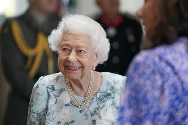 Queen Elizabeth II smiles during a visit to officially open the new building at Thames Hospice on July 15, 2022 in Maidenhead, England. (Photo by Kirsty O’Connor-WPA Pool/Getty Images)
