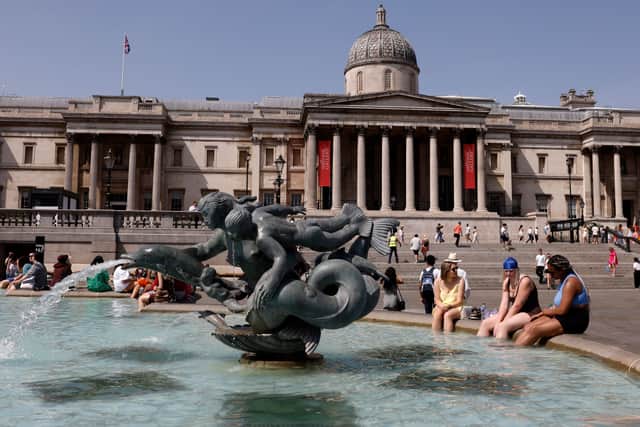 eople cool off beside the fountains in Trafalgar Square in central London on June 17, 2022