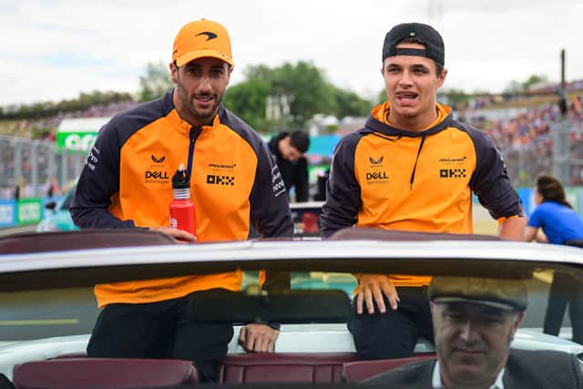 McLaren’s Daniel Ricciardo (L) and Lando Norris 