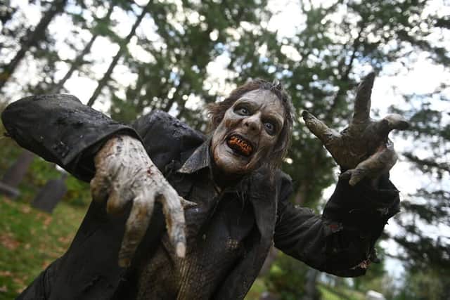 A zombie with rotting skin leers at the camera in Day of the Dead (Credit: Sergei Bachlakov/Syfy)