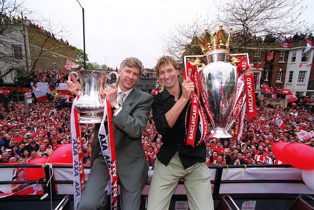 Wenger and Adams with the FA Cup and Premiership trophy in 2002