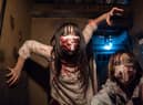 An actress and an actor dressed as zombies perform as customers dine in The Lock Up Tokyo prison themed restaurant in Tokyo, Japan (Photo by Tomohiro Ohsumi/Getty Images)