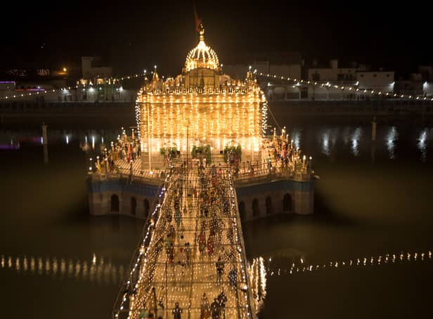 <p>Hindu devotees arrive to pay their respect on the occasion of the 'Janmashtami' festival marking the birth of Hindu God Lord Krishna</p>