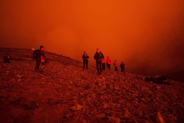 Visitors have arrived to watch the lava flow from the volcano in  in Fagradalsfjall, Iceland