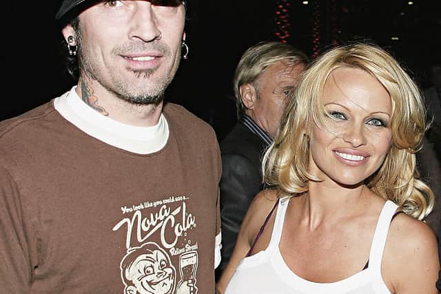 Pamela Anderson and Tommy Lee arrive at the Rodeo Drive Walk of Style Event Honoring Tom Ford on March 28, 2004 in Beverly Hills, California. (Photo by Giulio Marcocchi/Getty Images)