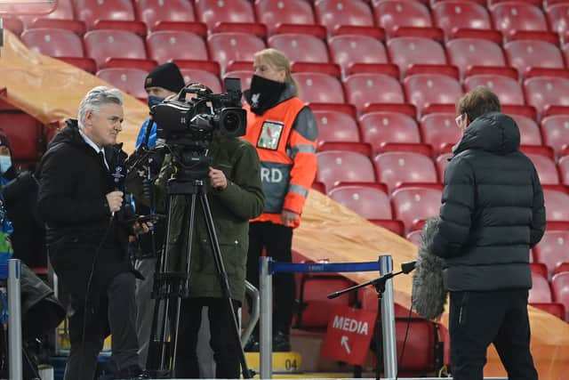 BT Sport broadcaster Des Kelly interviews Liverpool’s Jurgen Klopp before the Champions League 1st round at Anfield in 2020. (Photo by Michael Regan / POOL / AFP) (Photo by MICHAEL REGAN/POOL/AFP via Getty Images)