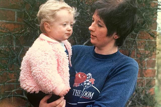 Photo of Lauren Palmer, pictured as a baby with her mother Barbara Palmer. Lauren was orphaned in 1993 when her mother and father died with HIV, eight days apart. 