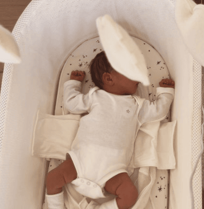 Baby Carmel in her crib. 