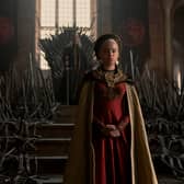 Milly Alcock as young Rhaenyra Targaryen, the Iron Throne and her father looming large behind her (Credit: HBO)