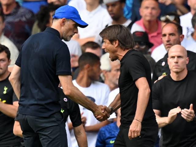 Tottenham Hotspur’s Italian head coach Antonio Conte (R) and Chelsea’s German head coach Thomas Tuchel (L) shake hands then clash after the English Premier League football match between Chelsea and Tottenham Hotspur at Stamford Bridge in London on August 14, 2022. (Photo by GLYN KIRK/AFP via Getty Images)