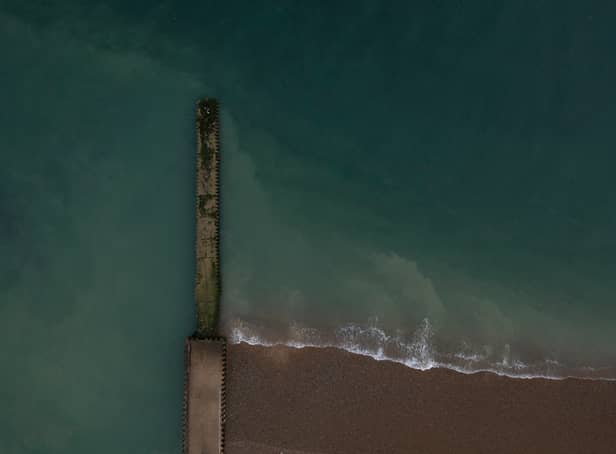 <p>SEAFORD, ENGLAND - AUGUST 17: A jetty beneath which raw sewage had been reportedly been discharged after heavy rain on August 17, 2022 in Seaford, England. The Environment Agency has issued pollution alerts across the UK after recent heavy rainfall and flooding have affected water quality. Sewers overflow into the sea and rivers when treatment plants are overwhelmed by torrential rain otherwise it would spill into streets or back up into toilets. Environmental campaign group Surfers Against Sewage reported that raw sewage had been released into the waters at beaches in Sussex, Cornwall, Devon, Essex, Lancashire, Lincolnshire, Northumberland and Cumbria. (Photo by Dan Kitwood/Getty Images)</p>