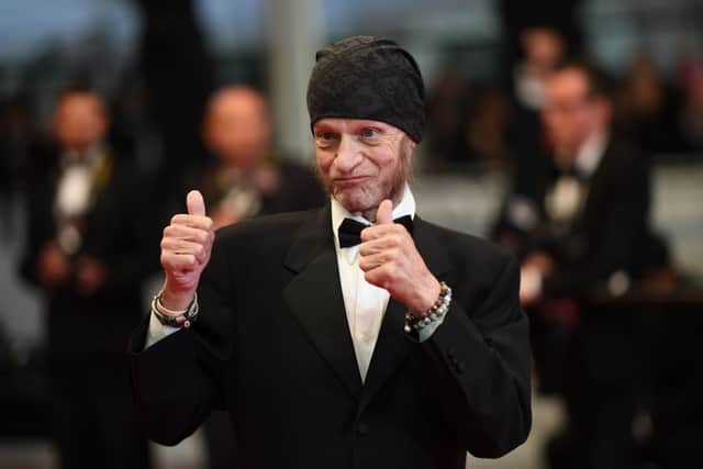 Leon Vitali gestures as he arrives for the screening of a remastered version of the film “The Shining” at the 72nd edition of the Cannes Film Festival in Cannes, southern France, on May 17, 2019. (Photo by LOIC VENANCE/AFP via Getty Images)