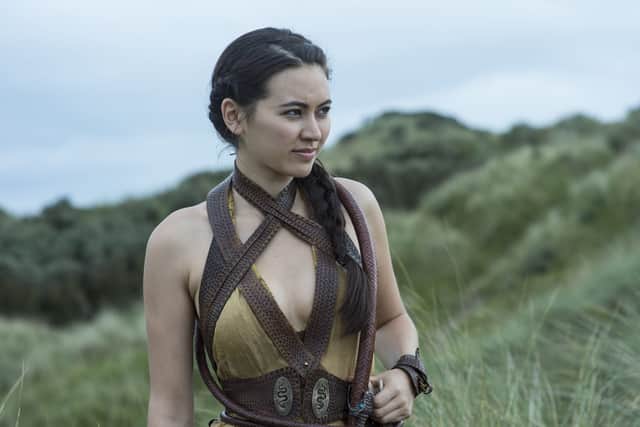 Jessica Henwick as Nymeria Sand in Game of Thrones, stood in a meadow (Credit: HBO)