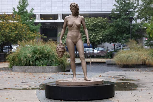 “Medusa With The Head of Perseus” by Argentine-Italian artist Luciano Garbati stands in Collect Pond Park on October 13, 2020 in New York City. In the wake of the #MeToo movement, the seven-foot bronze sculpture changes the narrative of Medusa, offering a different take on the 16th Century Florentine bronze statue of “Perseus with the Head of Medusa” by Benvenuto Cellini (Photo by Michael M. Santiago/Getty Images)