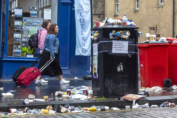 Bins have been overflowing after a busy Fringe weekend in Edinburgh as cleansing staff continue their strike. (Credit: SWNS)